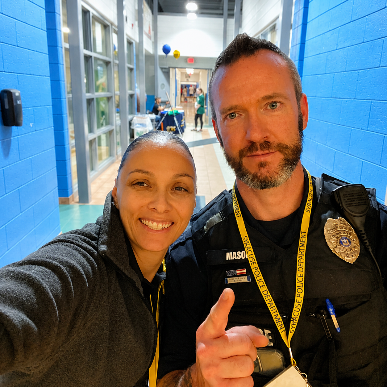 Officer Jackson with a fellow Syracuse Police officer at a school community event